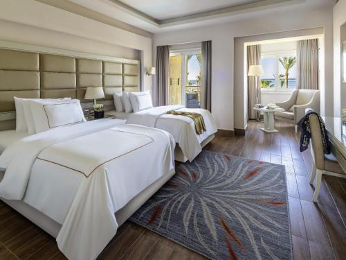 Postel nebo postele na pokoji v ubytování Rixos Premium Seagate