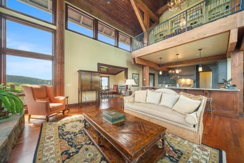 a living room with a couch and a table at Overlook at Wilderness Trail in Newland