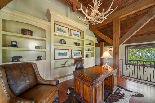 a home office with a desk and a chair at Overlook at Wilderness Trail in Newland