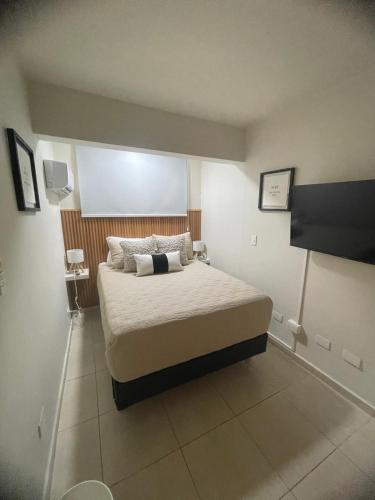 a bedroom with a large bed in a room at Hostal FT Santiago Stay in Santiago de los Caballeros