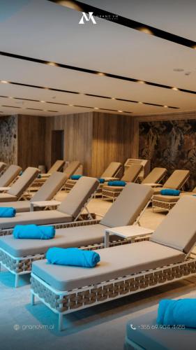 a row of lounge chairs in a room at Grand VM Conference & SPA in Golem