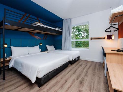 Una cama o camas en una habitación de ibis Styles Poços de Caldas