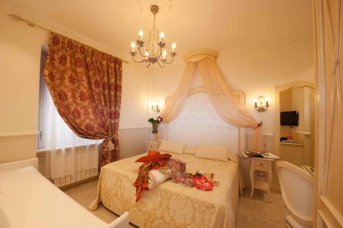 Ένα δωμάτιο στο Hotel Astigiana & Appartamenti