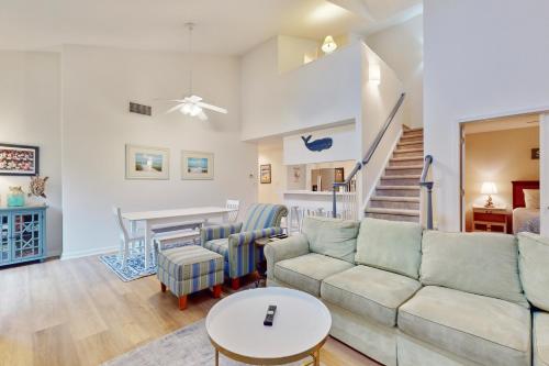 a living room with a couch and a table at Sea Colony - 56119 Cypress Lake Cir in Bethany Beach