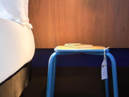 Un ou plusieurs lits dans un hébergement de l'établissement greet hotel Marseille Parc Chanot Velodrome
