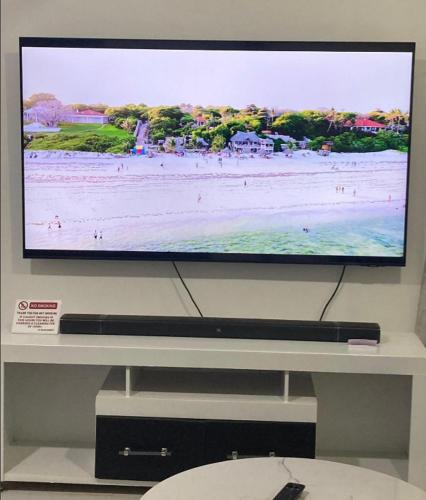 a flat screen tv sitting on top of a table at Pamito Sunny Paradise in Diani in Diani Beach