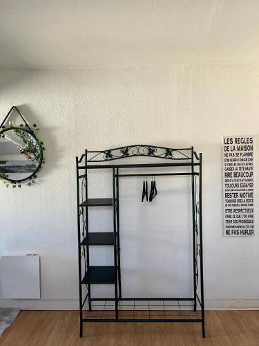 a black shelf in a room with a white wall at O'Jade Vincent 2 I Parking I Wifi I Près de la gare in Orléans