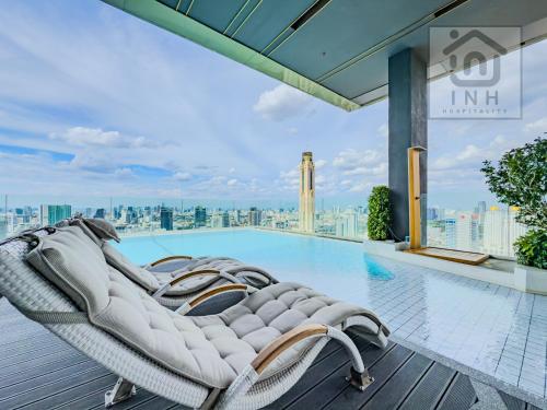 a pool on the roof of a building at 暹罗百丽宫奢华公寓 Siam Paragon Luxury Stay #W08 in Pratunam