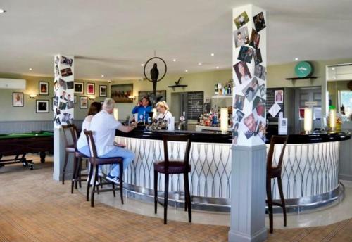 a group of people sitting at a bar at Loch View 28 in Stranraer