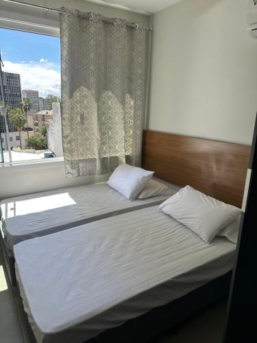 Ένα ή περισσότερα κρεβάτια σε δωμάτιο στο Studio novo todo mobiliado CENTRO da Capital ao lado do Hospital Santa Casa