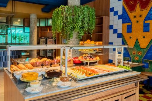 a buffet with many different types of food on display at ibis Styles Sorocaba Santa Rosalia in Sorocaba