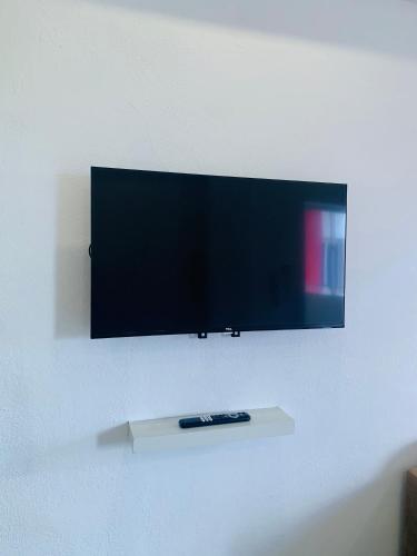 TV a/nebo společenská místnost v ubytování Plataview Apartahotel apt 4A