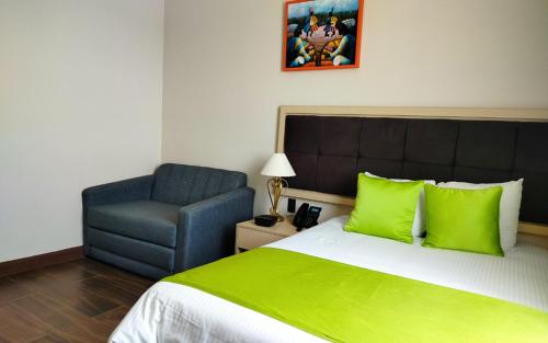 Postel nebo postele na pokoji v ubytování Hotel Puerto Limón CR