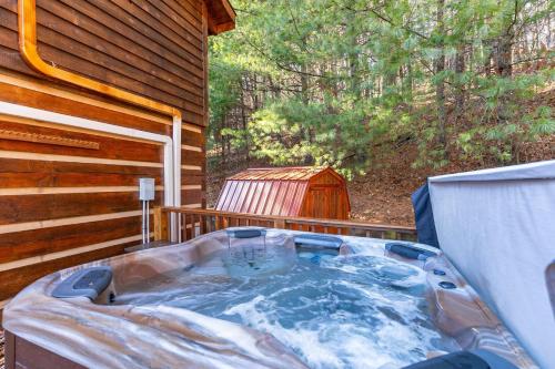 a hot tub on the back of a house at Moonlight Lodge in Fleetwood