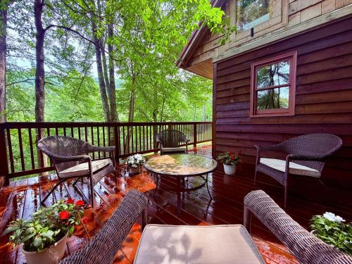 a patio with chairs and a table on a deck at Moonlight Lodge in Fleetwood