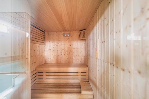 a sauna with wooden floors and a wooden ceiling at Bayview Hills Suite by Casasol in Torrox