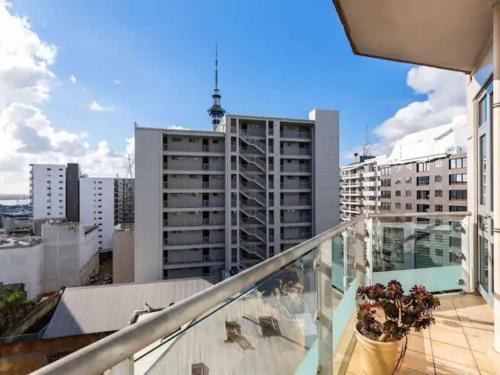 a balcony with a view of a city at Spacious Home with Balcony Parking Zodiak Stays in Auckland