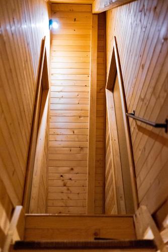 an overhead view of a staircase in a wooden building at Blidinje Lake House in Blidinje