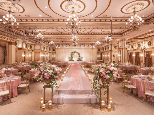 a banquet hall with tables and chairs and flowers at Grand Mercure Imperial Palace Seoul Gangnam in Seoul