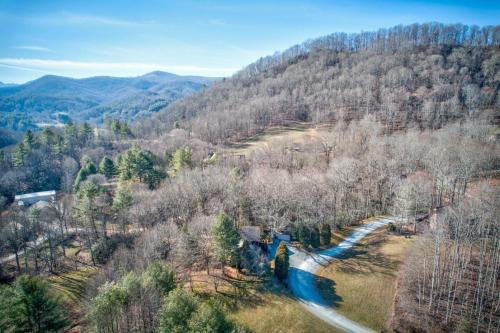an aerial view of a winding road in a forest at Fox's Lair in Sugar Grove