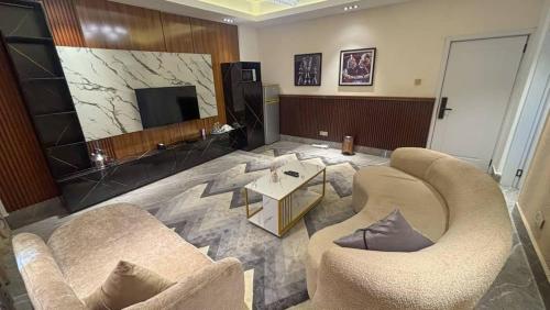 TV a/nebo společenská místnost v ubytování Sujimoto Residences MacDonald