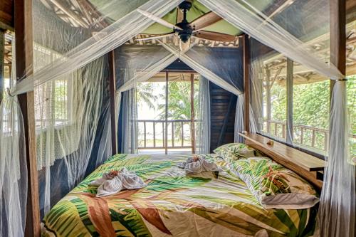 Postel nebo postele na pokoji v ubytování Casa Verde, Casa Aviari, Contiki