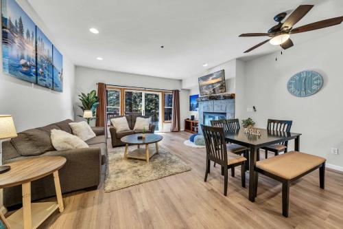 a living room with a couch and a table at 2BDR Condo - Three Minutes to Olympic Valley! in Tahoe City
