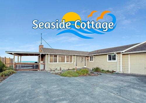 a house with the seashide cottage sign on it at Sq Seaside Cottage in Sequim
