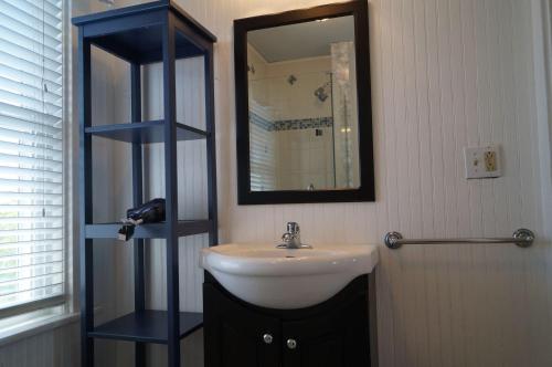 a bathroom with a sink and a mirror at Short Sands View in York Beach