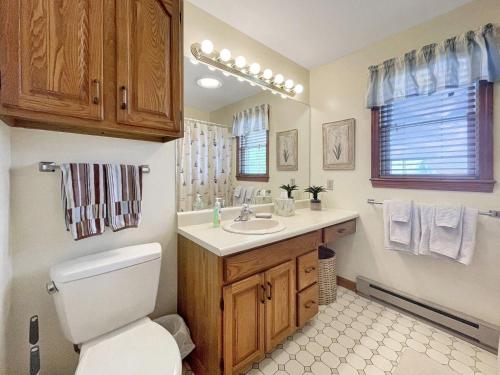 a bathroom with a toilet and a sink at High View at Short Sands in York