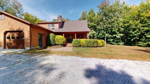 a house with a garage and a driveway at Beechwood Home in Mendon