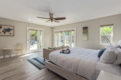 a bedroom with a large bed and a ceiling fan at Mountain Serenity-Private Pool-Old Town Scottsdale in Scottsdale