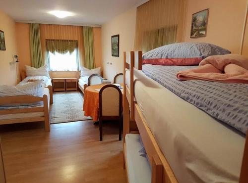 Postel nebo postele na pokoji v ubytování Guest House Rose