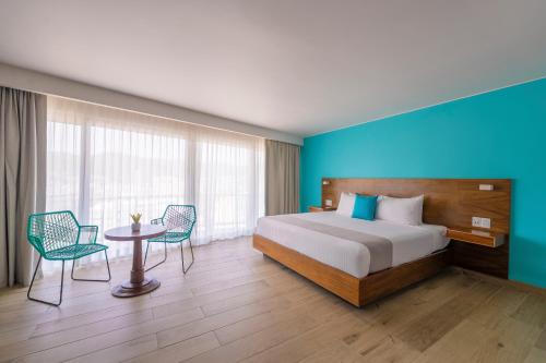 Ένα ή περισσότερα κρεβάτια σε δωμάτιο στο Hotel Amares Acapulco