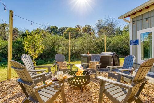 a patio with chairs and a grill at Mountain View Splash - Indoor Pool Hot Tub Game Room Stunning Smoky Mountain Views in Wear Valley