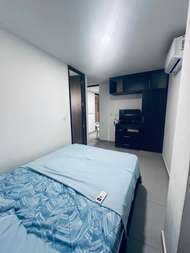 Postel nebo postele na pokoji v ubytování Hermoso apartamento con Aire Acondicionado Cerca al Hospital de Neiva