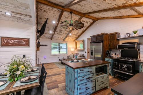 a kitchen with an island and a table in a room at Up the Creek in Linville