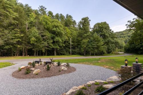 a garden with a flower bed in the middle of a road at Up the Creek in Linville