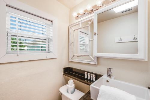a bathroom with a sink and a mirror at Casa Mariposa SPV19 in Port Aransas