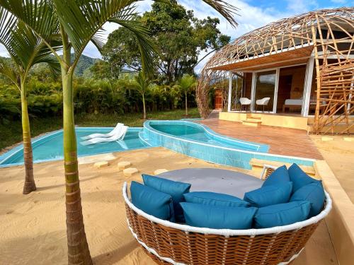 a resort with a hammock and a swimming pool at IslaVerde Hotel in La Mesa