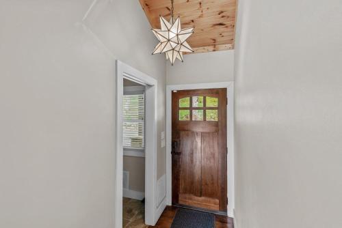 a hallway with a wooden door and a star ceiling at Starlight Ridge in Seven Devils