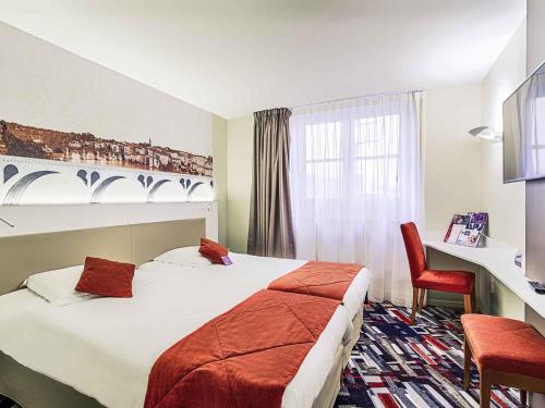 Ένα ή περισσότερα κρεβάτια σε δωμάτιο στο Mercure Albi Rives du Tarn