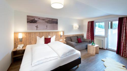Ένα ή περισσότερα κρεβάτια σε δωμάτιο στο Hotel Bergland Superior