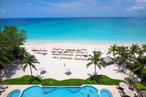 an aerial view of a beach with palm trees and the ocean at Beachcomber 39 in George Town