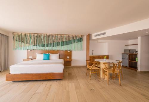 Ένα ή περισσότερα κρεβάτια σε δωμάτιο στο Hotel Amares Acapulco