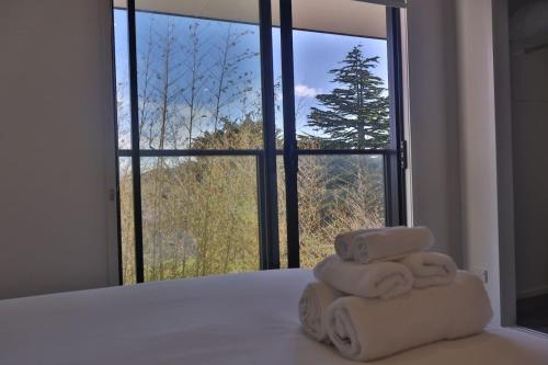 Ένα ή περισσότερα κρεβάτια σε δωμάτιο στο Cosy 2BR House in Carrington Rd.