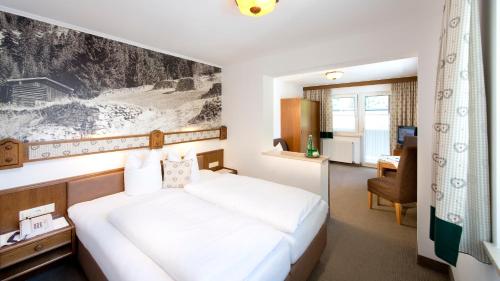 Posteľ alebo postele v izbe v ubytovaní Hotel Bergland Superior