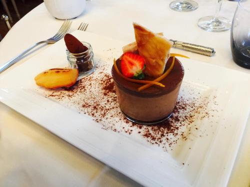a dessert on a white plate on a table at Le Cheval Blanc in Jargeau