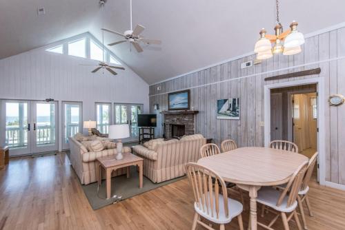 a living room with a table and a couch at Crowfield in Edisto Beach