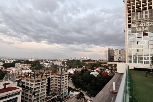 a view of a city from a building at Hidden Gem Collection Interlomas in Mexico City